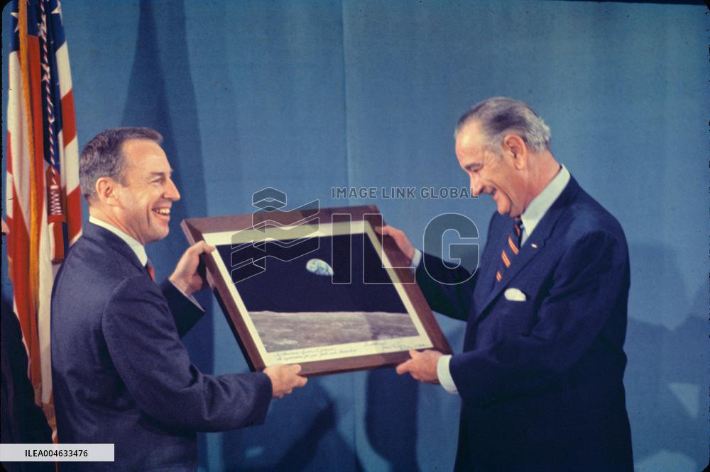 Jim Lovell Presents President Johnson with an Engraved Print of “Earthrise”