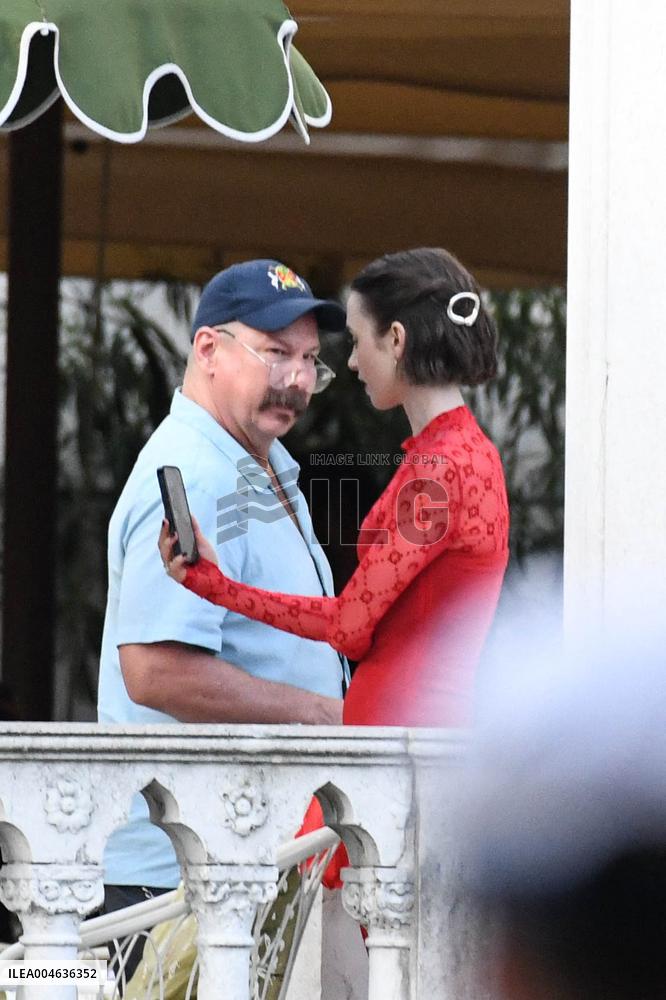 Lily Collins Takes a FaceTime Break during Emily in Paris Set - Venice