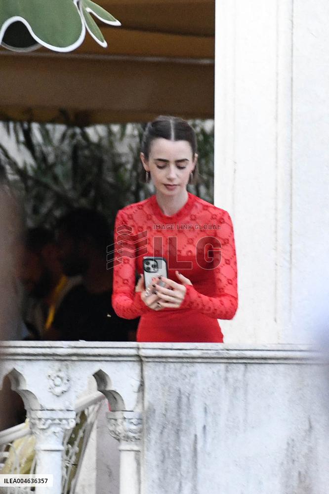 Lily Collins Takes a FaceTime Break during Emily in Paris Set - Venice