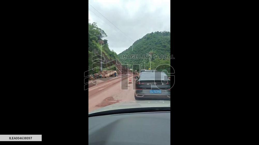 China: Dramatic Moment Huge Rocks From Landslide Crash Onto Mountain Road