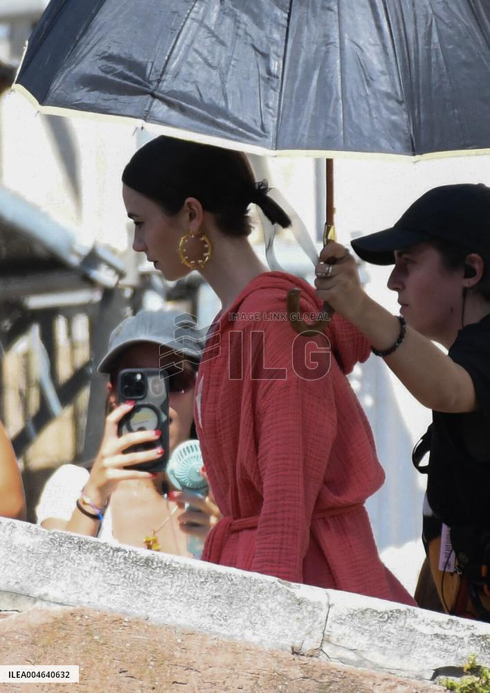 Lilly Collins Takes a Break While Filming Emily in Paris - Venice