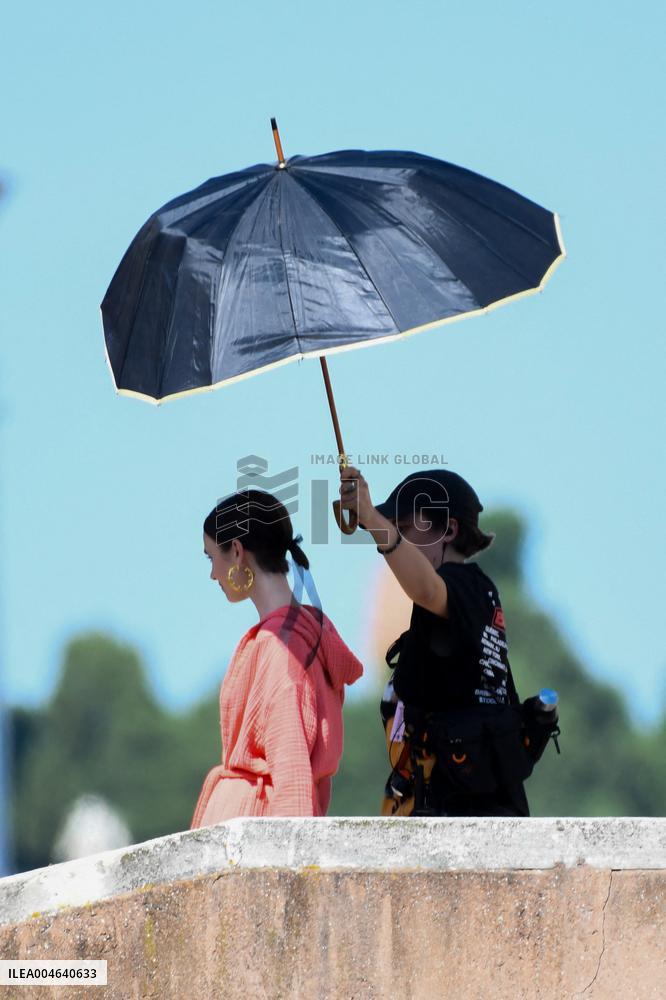 Lilly Collins Takes a Break While Filming Emily in Paris - Venice