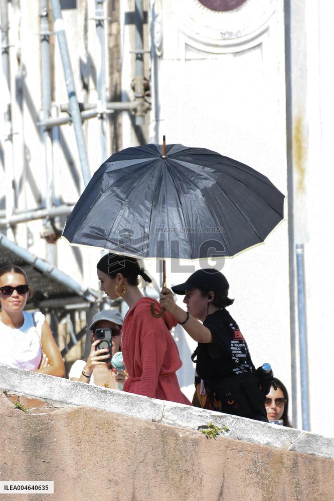 Lilly Collins Takes a Break While Filming Emily in Paris - Venice