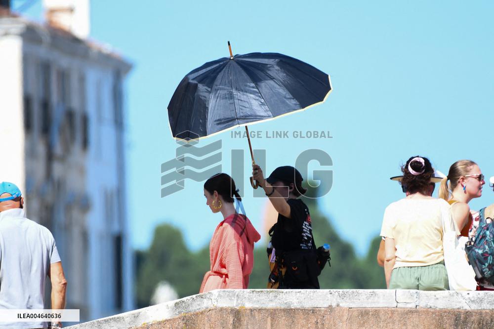 Lilly Collins Takes a Break While Filming Emily in Paris - Venice