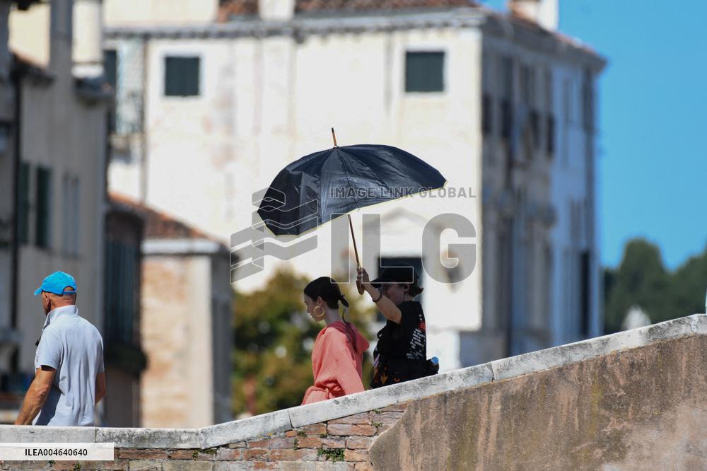 Lilly Collins Takes a Break While Filming Emily in Paris - Venice