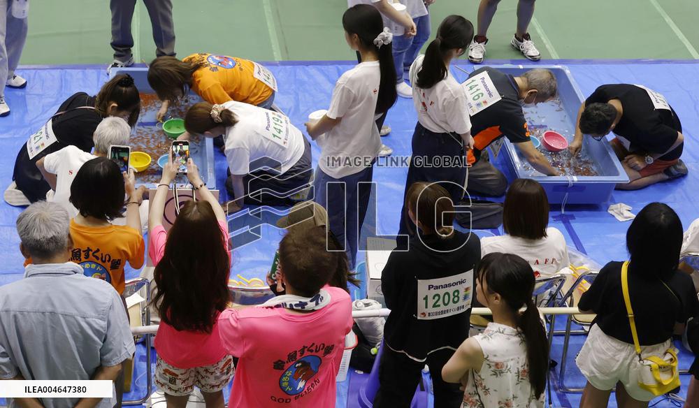 Goldfish scooping competition