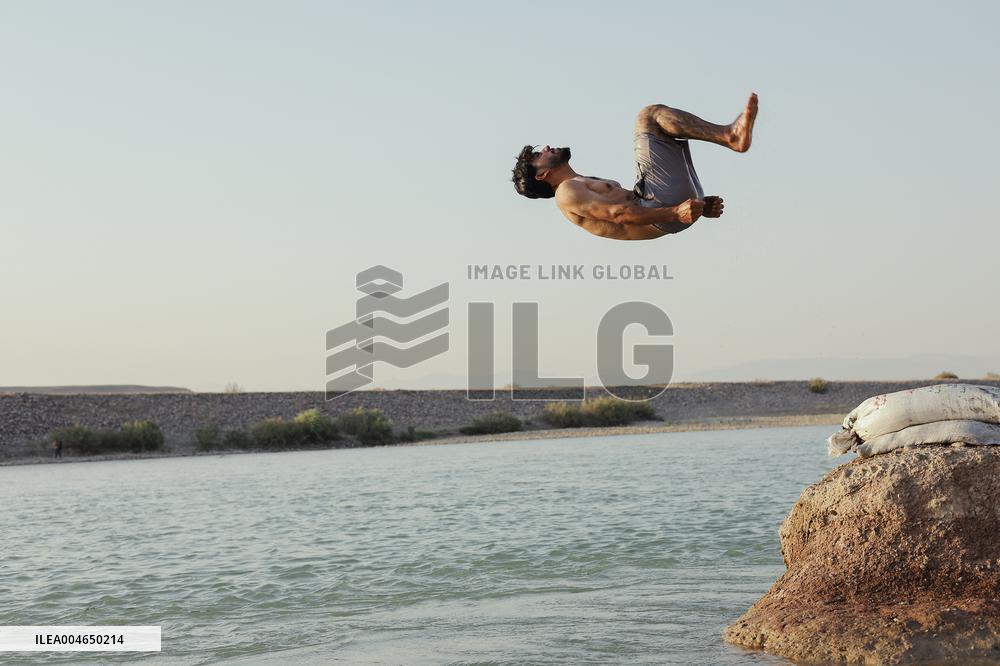 Young Iraqis Swim In The River - Erbil