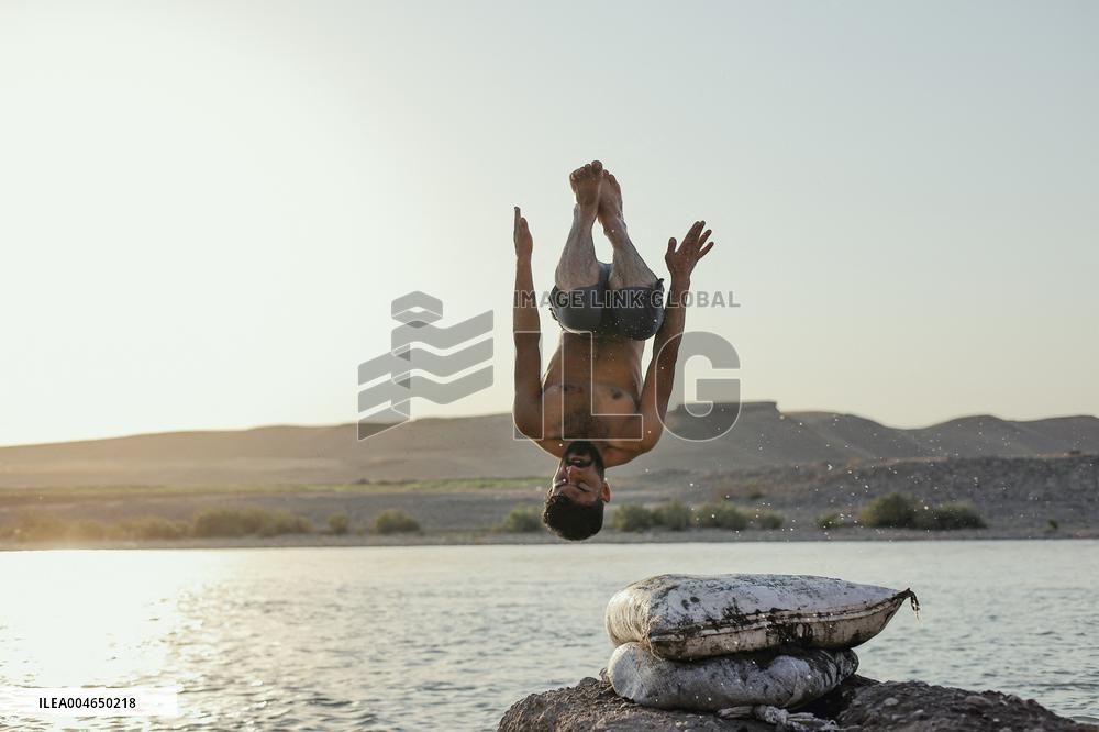 Young Iraqis Swim In The River - Erbil