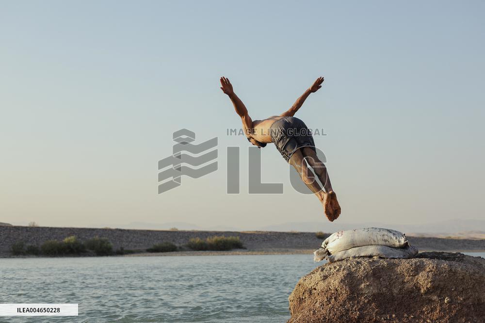 Young Iraqis Swim In The River - Erbil