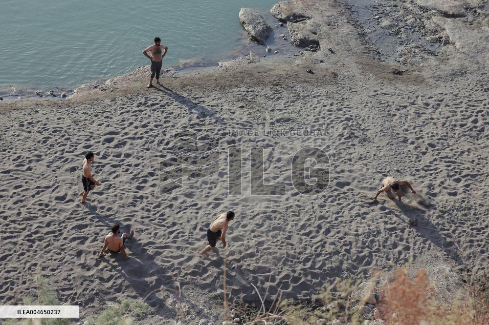 Young Iraqis Swim In The River - Erbil