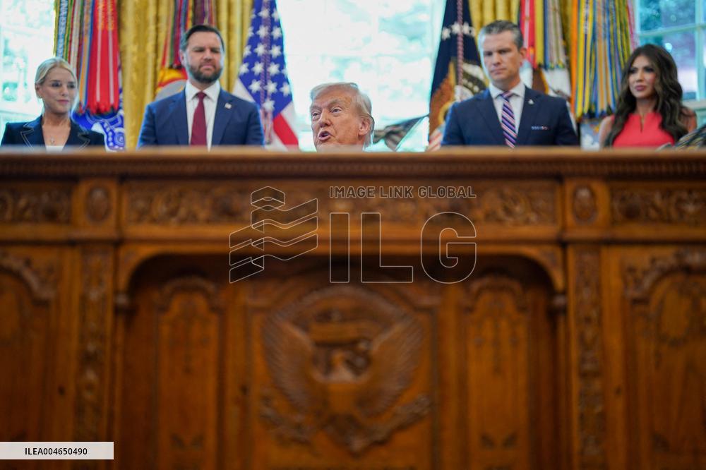 White House - Trump Signing Executive Order in The Oval Office