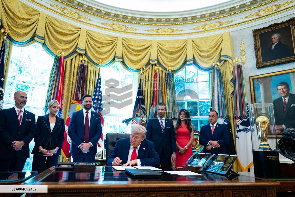 Trump Signs Executive Order In Oval Office - DC