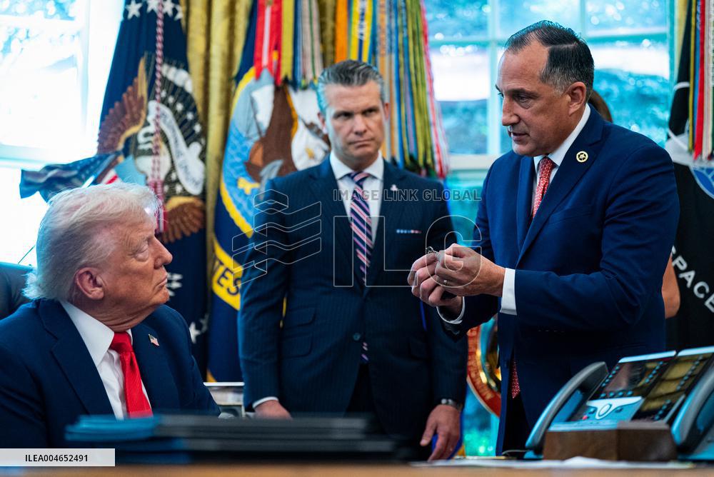 Trump Signs Executive Order In Oval Office - DC