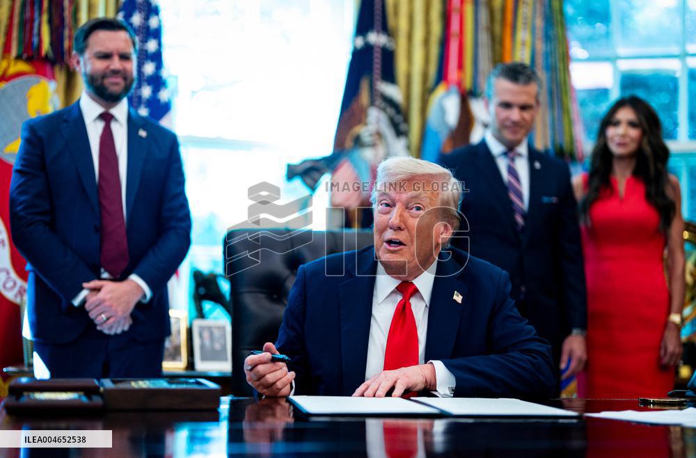 Trump Signs Executive Order In Oval Office - DC