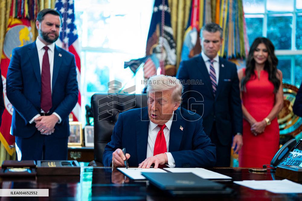 Trump Signs Executive Order In Oval Office - DC