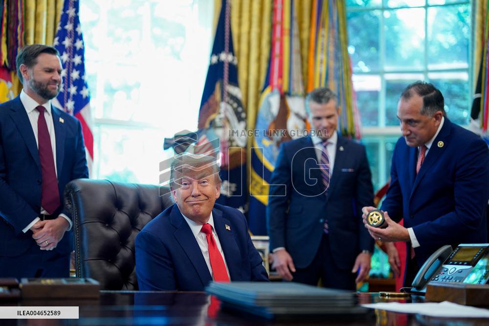 Trump Signs Executive Order In Oval Office - DC