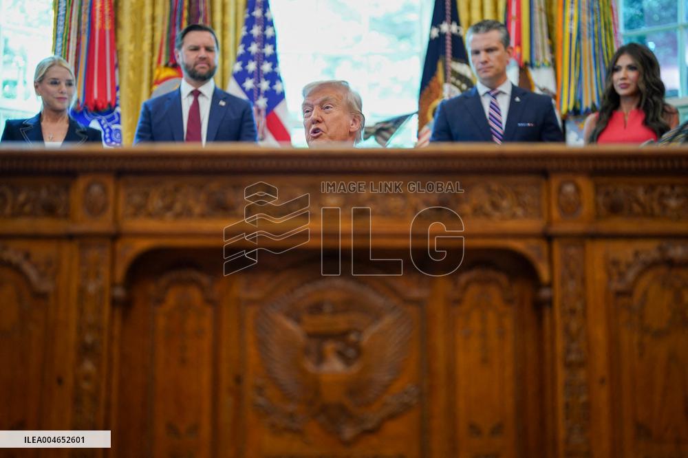 Trump Signs Executive Order In Oval Office - DC