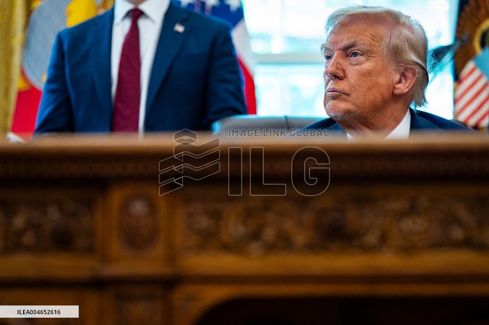 Trump Signs Executive Order In Oval Office - DC