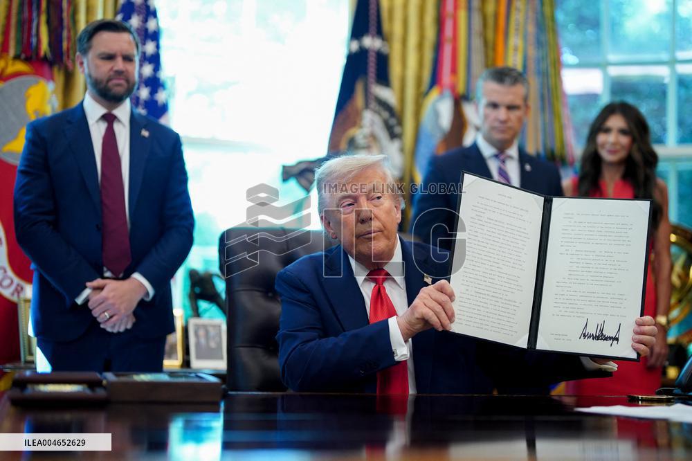 Trump Signs Executive Order In Oval Office - DC