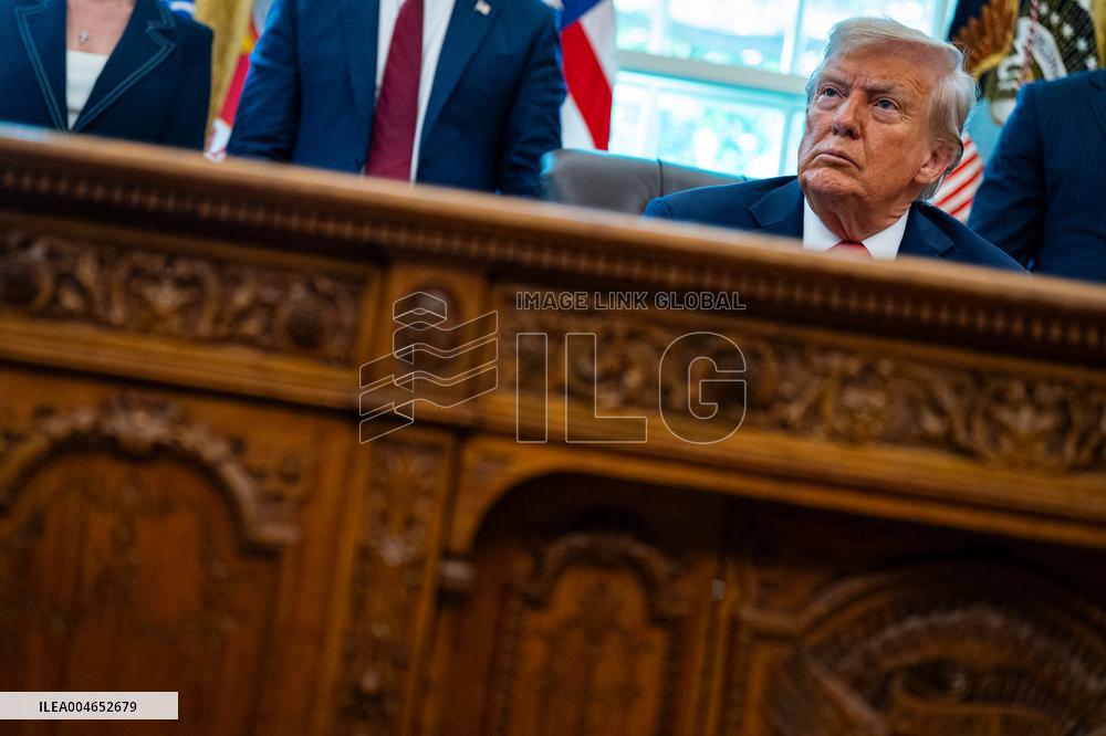 Trump Signs Executive Order In Oval Office - DC