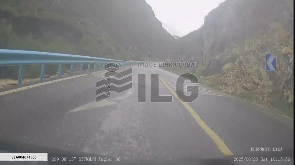 China: Motorcyclist With Daughter Braves Rockfall on Genie South Route in Sichuan