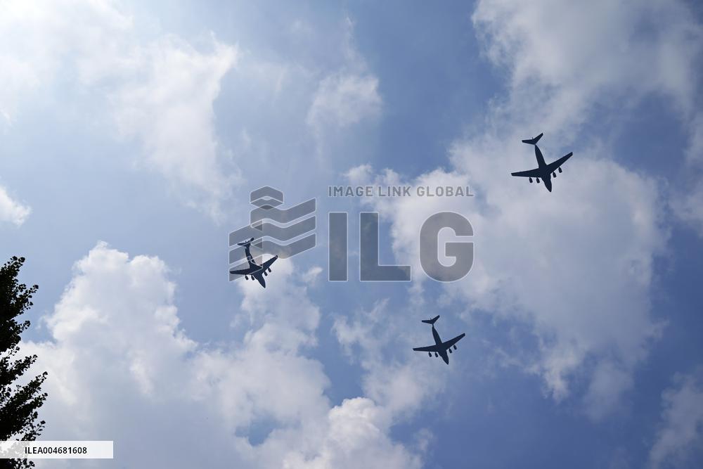 Citizens Watch Military Parade Aircraft in Beijing