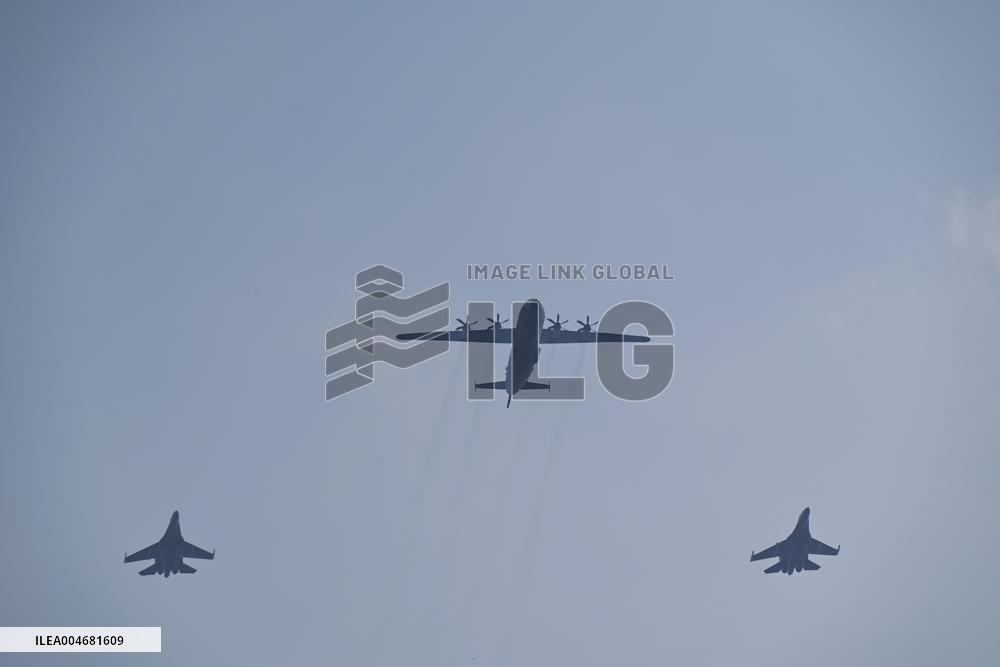 Citizens Watch Military Parade Aircraft in Beijing