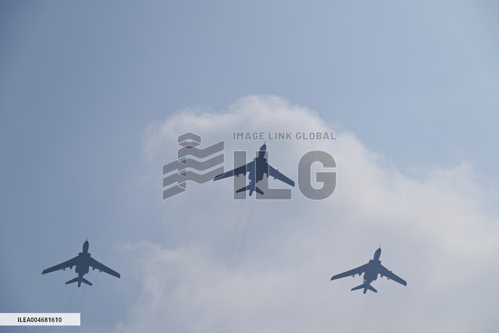 Citizens Watch Military Parade Aircraft in Beijing