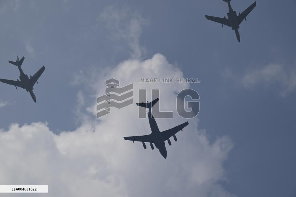 Citizens Watch Military Parade Aircraft in Beijing