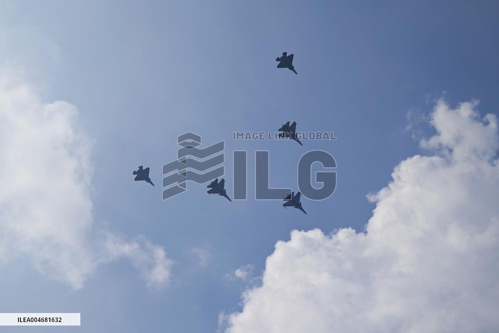 Citizens Watch Military Parade Aircraft in Beijing