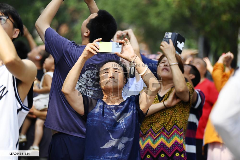 Citizens Watch Military Parade Aircraft in Beijing