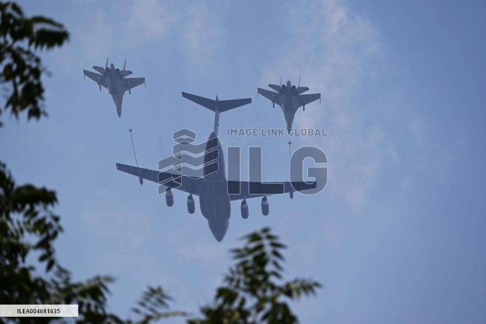 Citizens Watch Military Parade Aircraft in Beijing