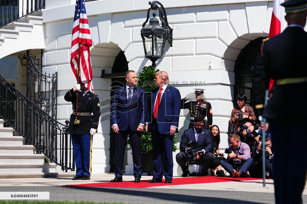 Trump greets President Karol Nawrocki of Poland on the South Portico of the White House