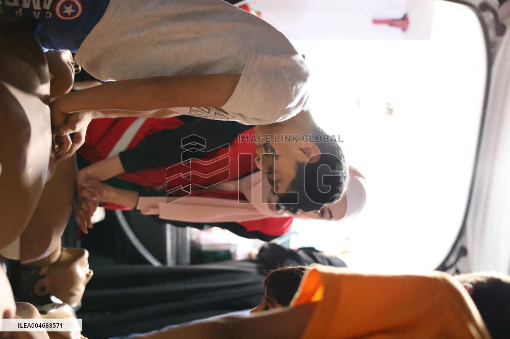 Syrian Red Crescent Volunteers Training Children In First Aid At Damascus International Fair