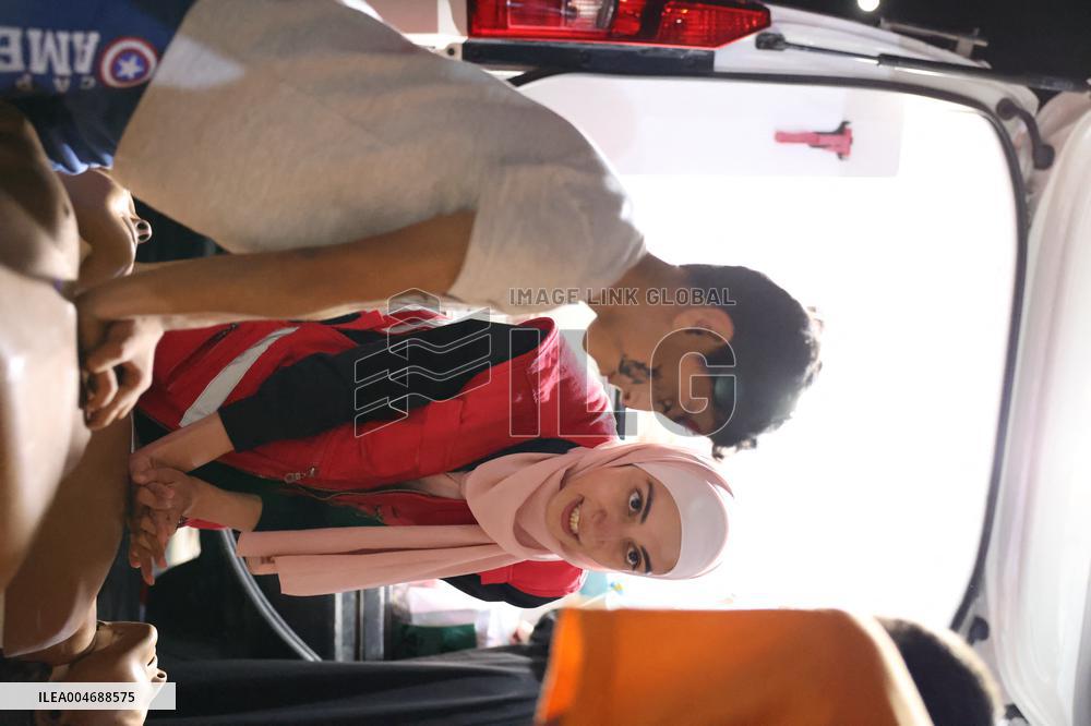 Syrian Red Crescent Volunteers Training Children In First Aid At Damascus International Fair