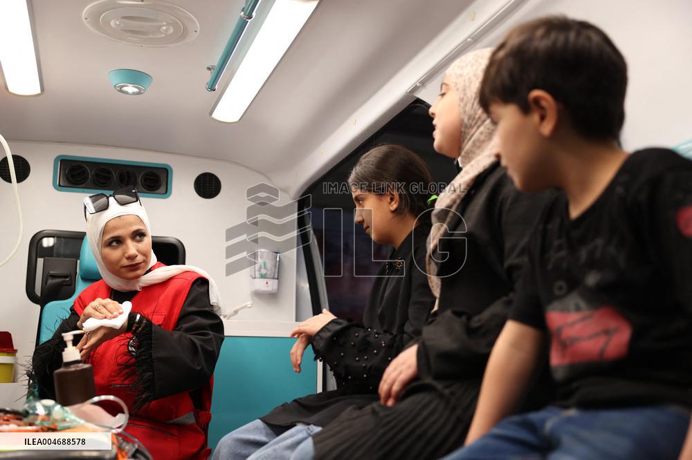 Syrian Red Crescent Volunteers Training Children In First Aid At Damascus International Fair