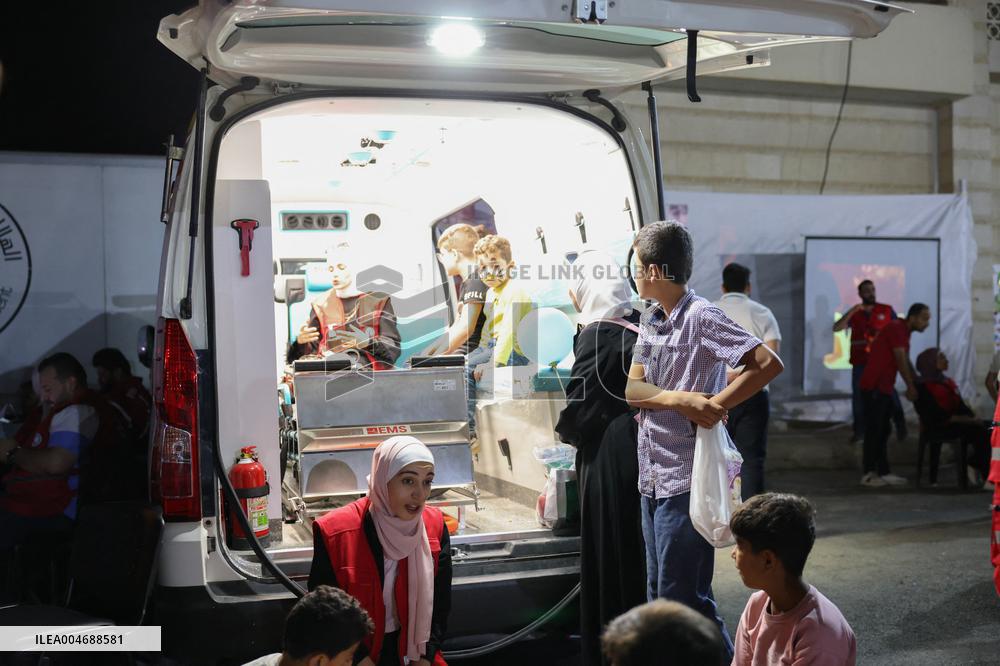 Syrian Red Crescent Volunteers Training Children In First Aid At Damascus International Fair