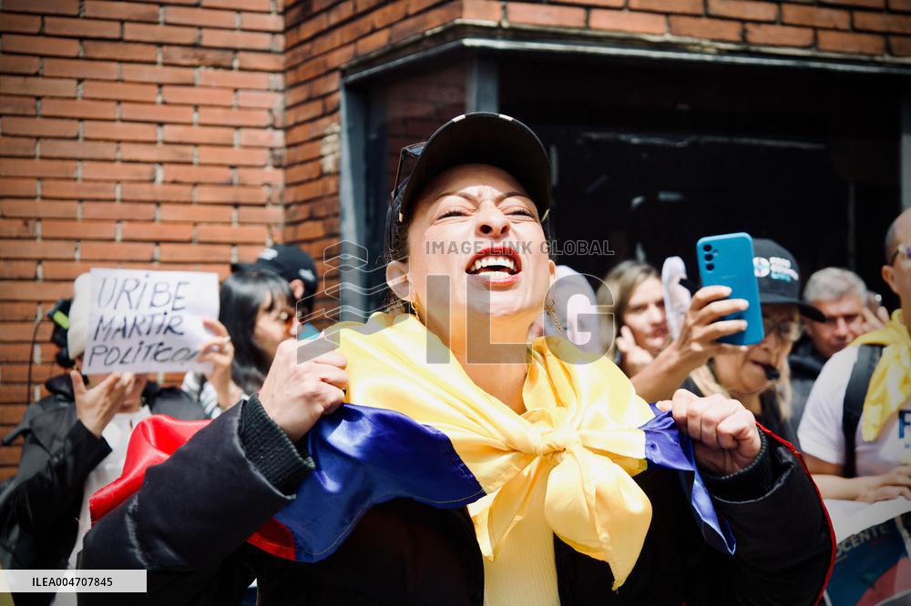 Supporters Hold Masks of Former President Alvaro Uribe During Trial in Bogota