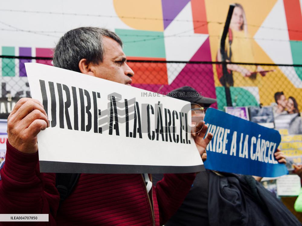 Supporters Hold Masks of Former President Alvaro Uribe During Trial in Bogota