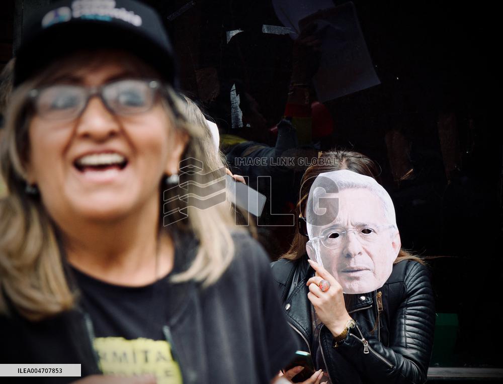Supporters Hold Masks of Former President Alvaro Uribe During Trial in Bogota