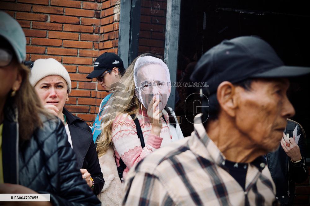 Supporters Hold Masks of Former President Alvaro Uribe During Trial in Bogota
