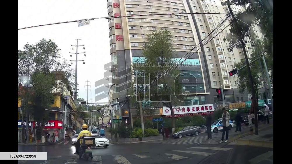 China: Black Audi Crashes Into White Sedan at Intersection After Losing Control