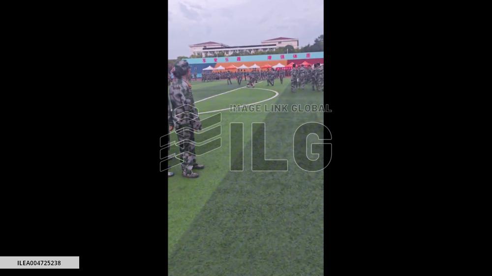 China: Mischievous Dog Snatches Hat and Shoe During Military Training in Xi’an