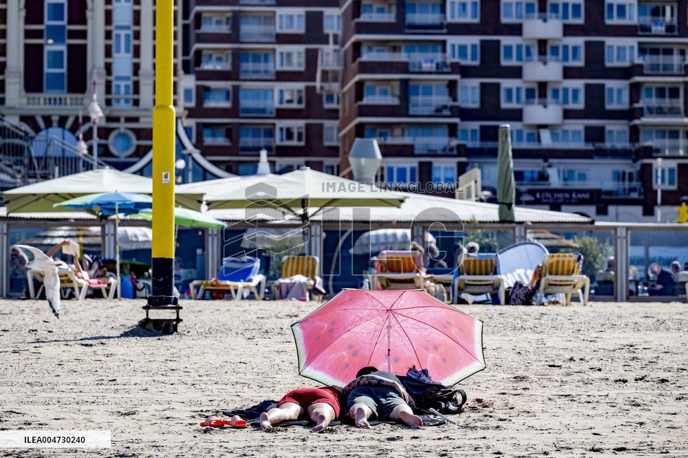 Beachgoers Enjoy Late Summer Warm Weather - Netherlands