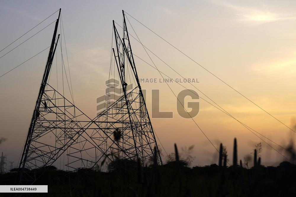 Workers Are Installing a High-Voltage Electricity Pylon - India