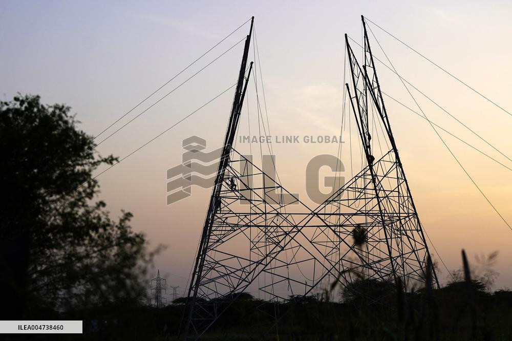 Workers Are Installing a High-Voltage Electricity Pylon - India
