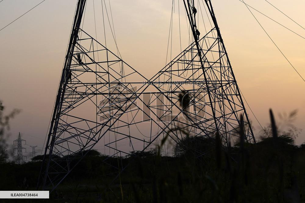 Workers Are Installing a High-Voltage Electricity Pylon - India