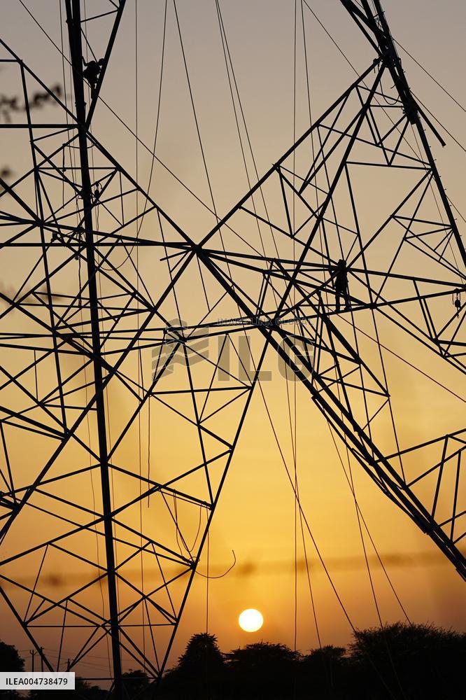 Workers Are Installing a High-Voltage Electricity Pylon - India
