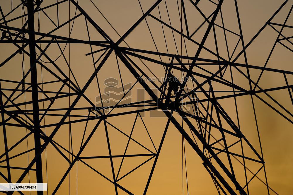 Workers Are Installing a High-Voltage Electricity Pylon - India