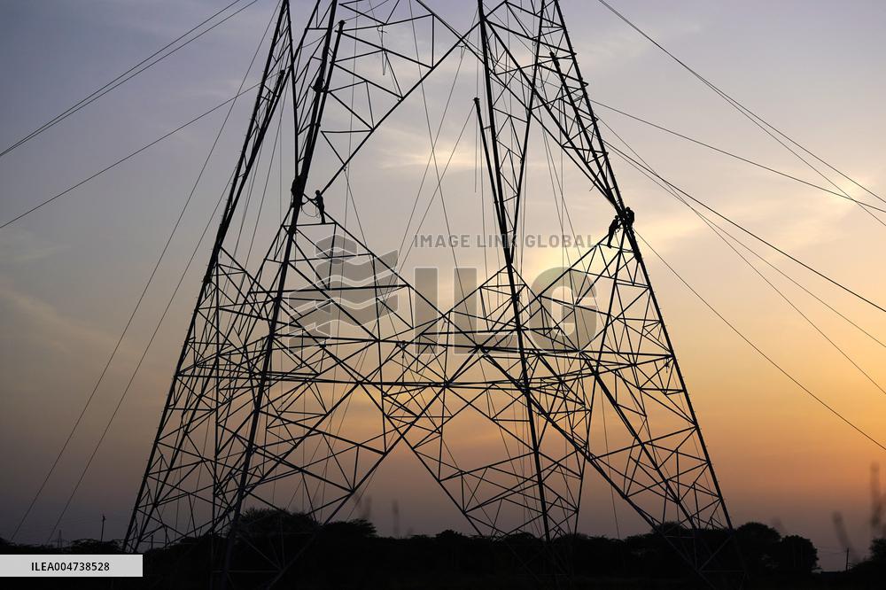 Workers Are Installing a High-Voltage Electricity Pylon - India